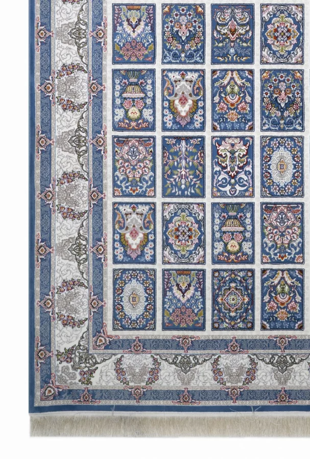 A Qaleen Carpets rug with a blue and white patterned design, featuring intricate patterns and a border of flowers and leaves