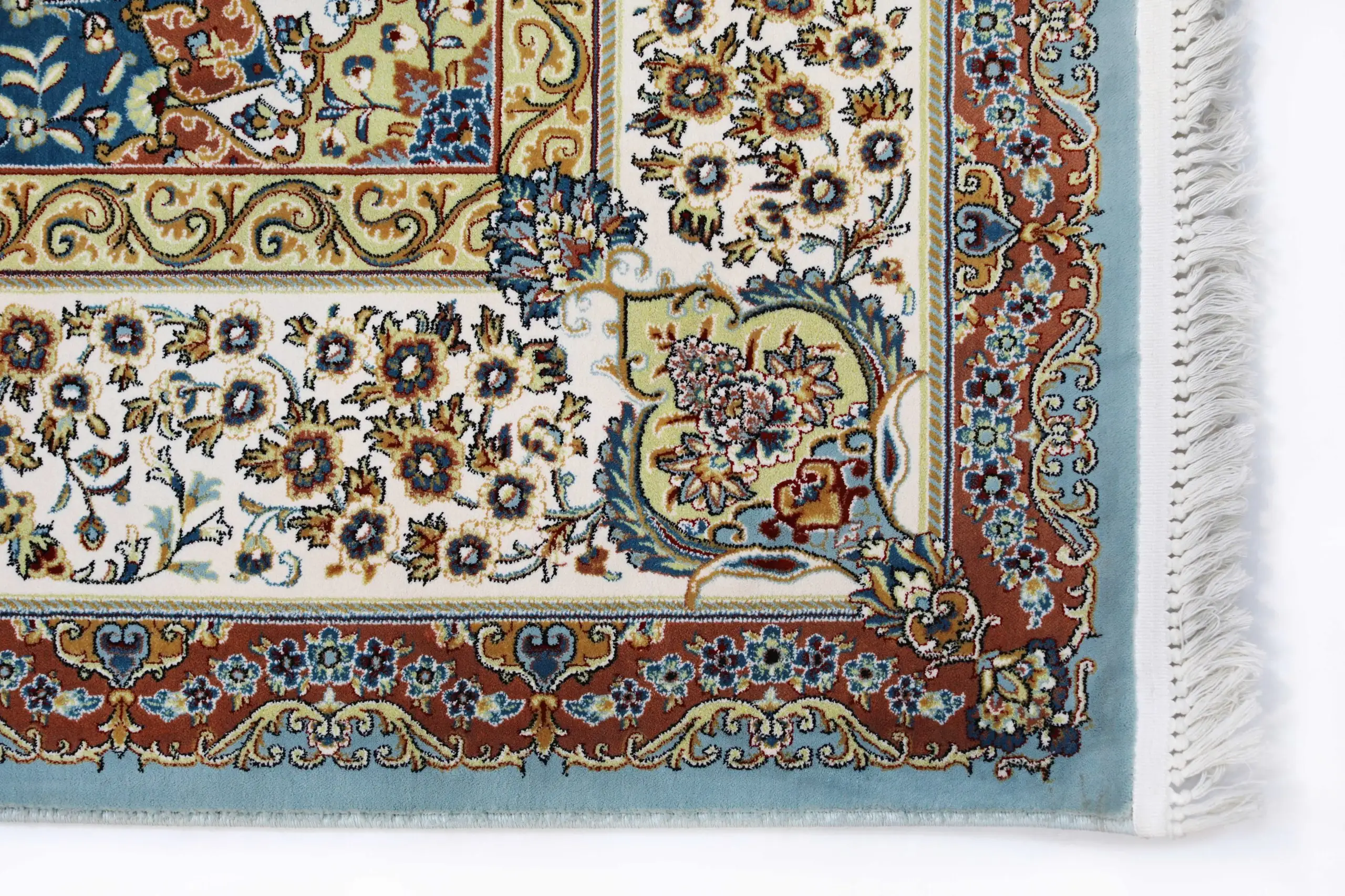 A close-up of a Qaleen Carpets rug with intricate floral patterns and a border, showcasing the company's high-quality and