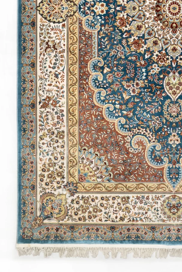 A close-up of a Qaleen Carpets rug with intricate patterns and colors, showcasing its unique design and quality