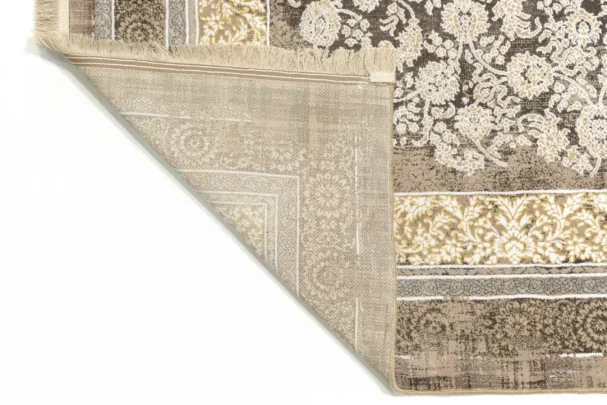 A close-up of a Qaleen Carpets rug's corner, showcasing its intricate design and rich colors
