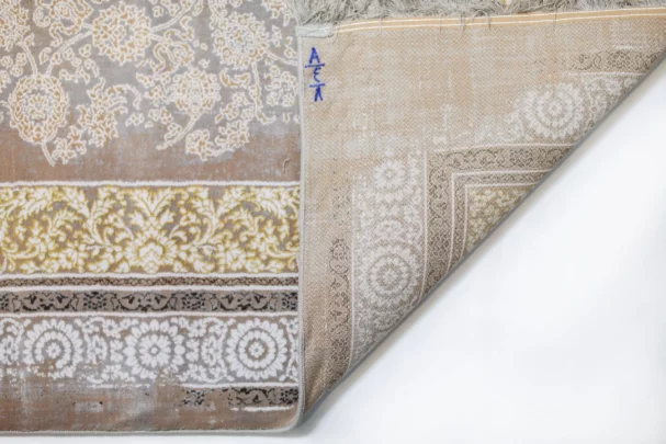 A close-up of a Qaleen Carpets rug, showcasing its intricate patterns and high-quality materials