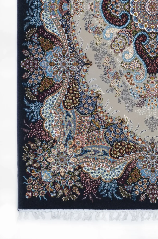 A qaleen carpet with a floral pattern and a fringe at the bottom, showcasing a mix of blue, red, and white colors