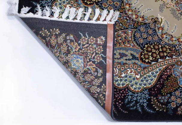 A close-up of a Qaleen Carpets rug's corner, showing its intricate design and pattern