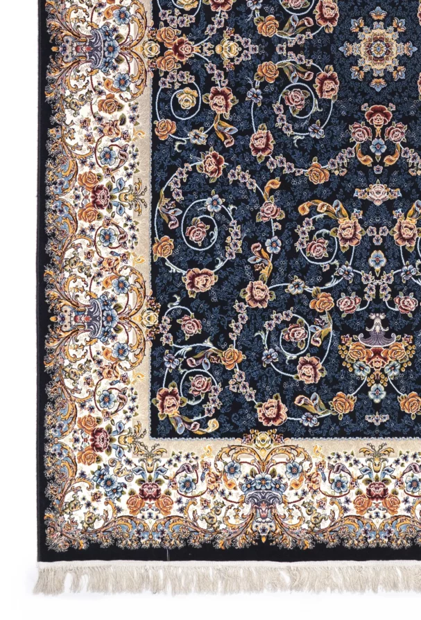 A close-up of a Qaleen Carpets rug with a dark blue background and intricate floral patterns, featuring a mix of roses,