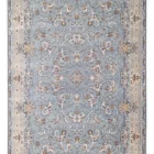 A stunning Qaleen Carpets rug with intricate patterns and a soft, grey background, perfect for adding a touch of elegance to