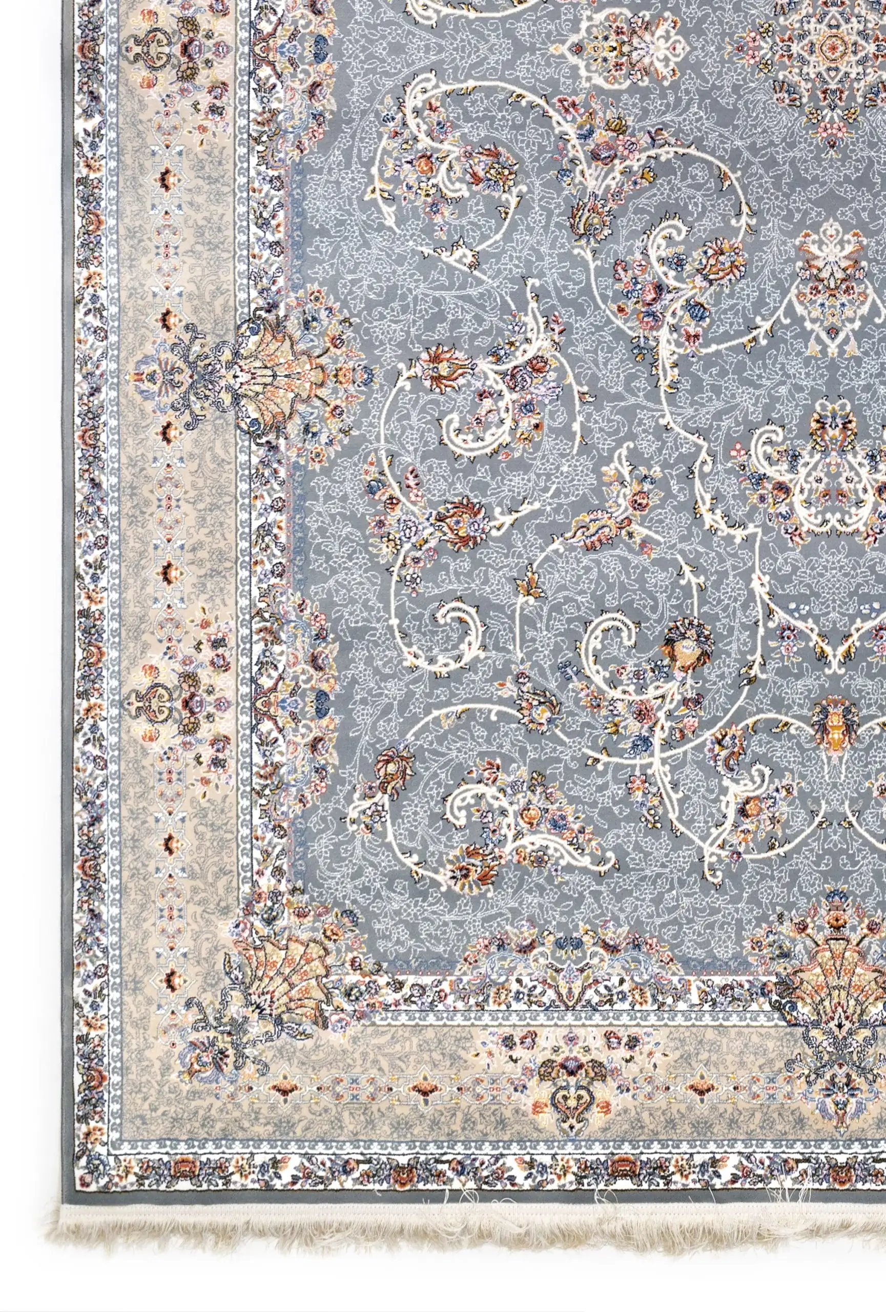 A close-up of a Qaleen Carpets rug with a grey and cream patterned design, featuring intricate floral and vine motifs, set