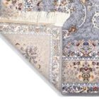A close-up of a Qaleen Carpets rug, showcasing its intricate patterns and colors