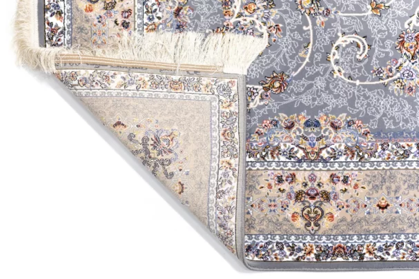 A close-up of a Qaleen Carpets rug, showcasing its intricate patterns and colors