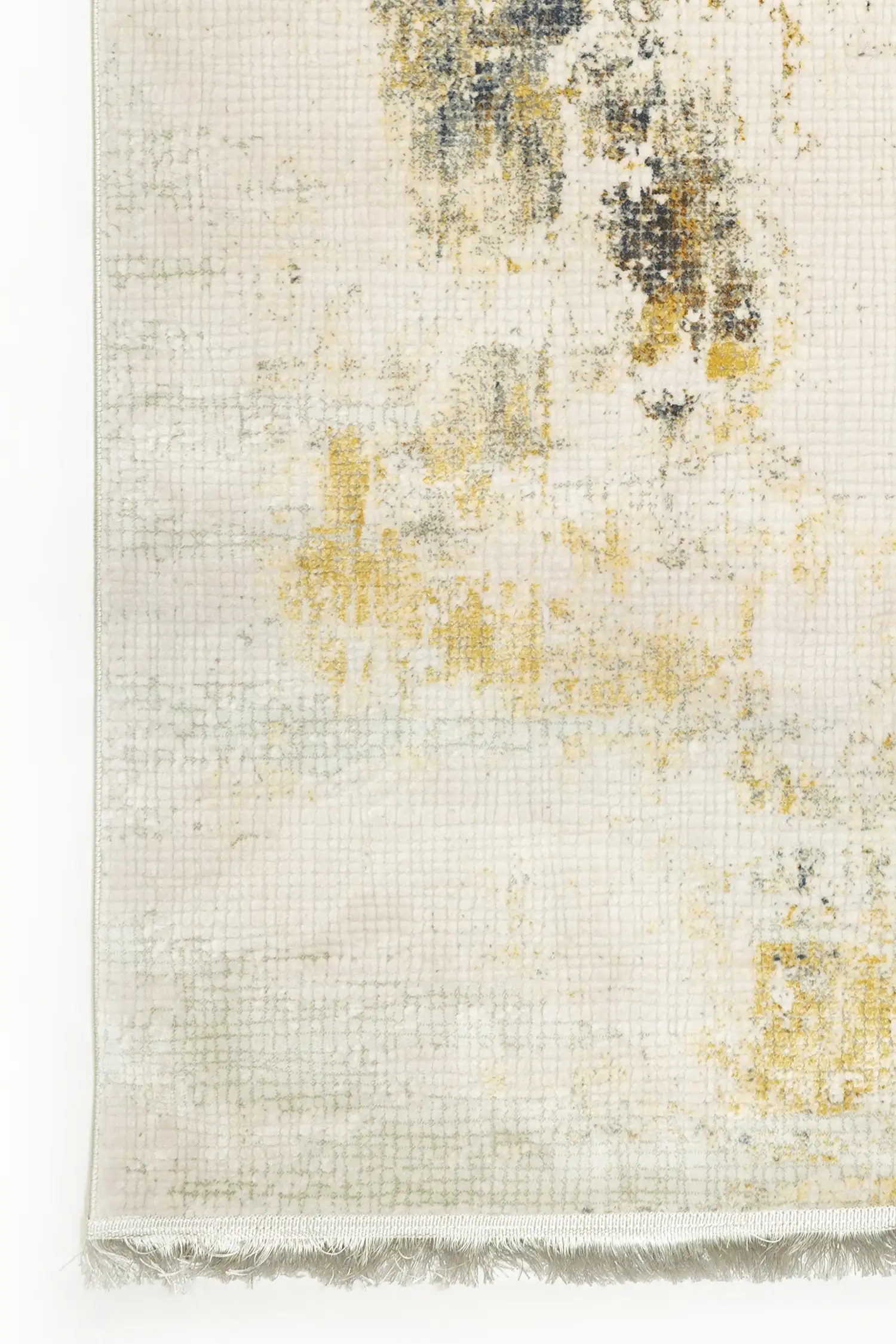 A close-up of a Qaleen Carpets rug with a cream and gold design, featuring a subtle, intricate pattern and a soft, luxurious