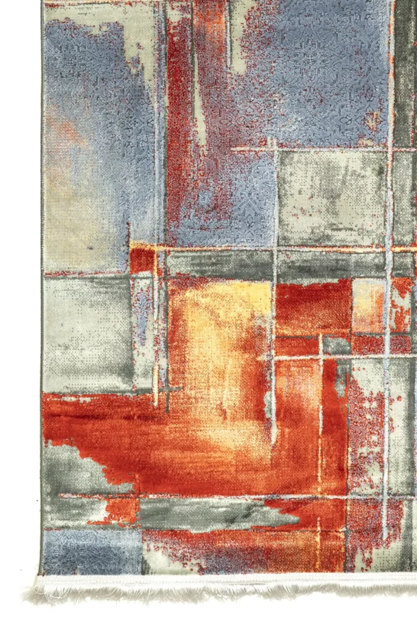 A vibrant, abstract rug with a mix of red, blue, and yellow hues, featuring a unique blend of patterns and textures, made by