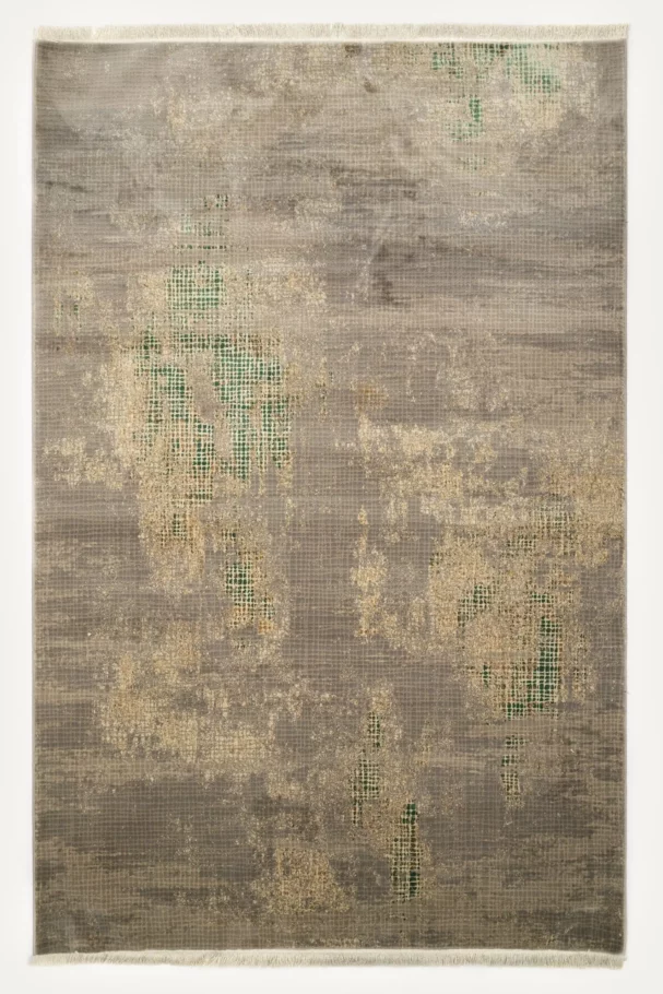 A Qaleen Carpets rug with a unique, hand-woven design featuring a blend of traditional and modern elements, with a focus on