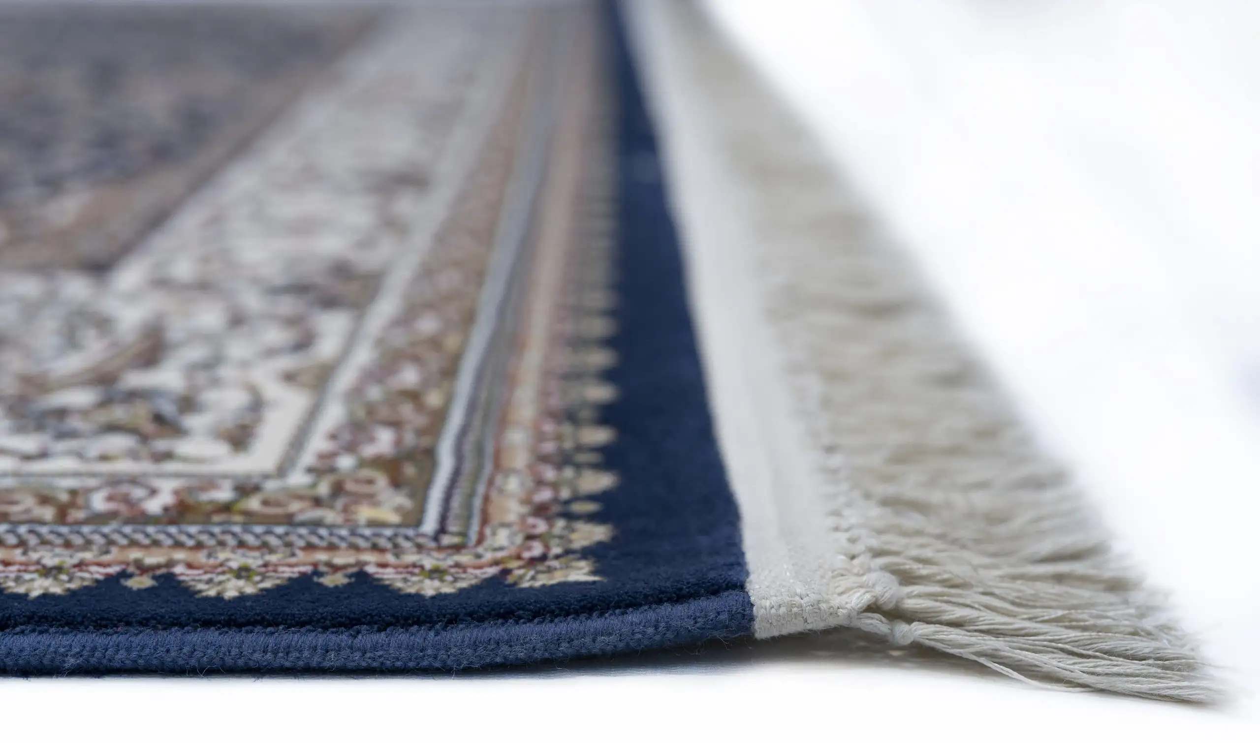 Carpets A close-up of a carpet's edge, with a focus on the intricate patterns and colors