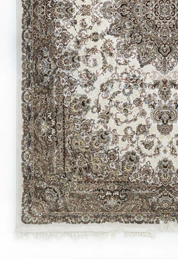 A close-up of a Qaleen Carpets rug with intricate, floral patterns in a neutral color palette