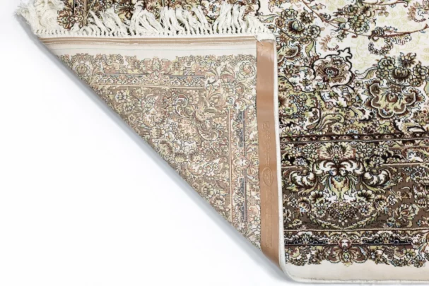 A close-up of a Qaleen Carpets rug's corner, showcasing its intricate design and rich colors
