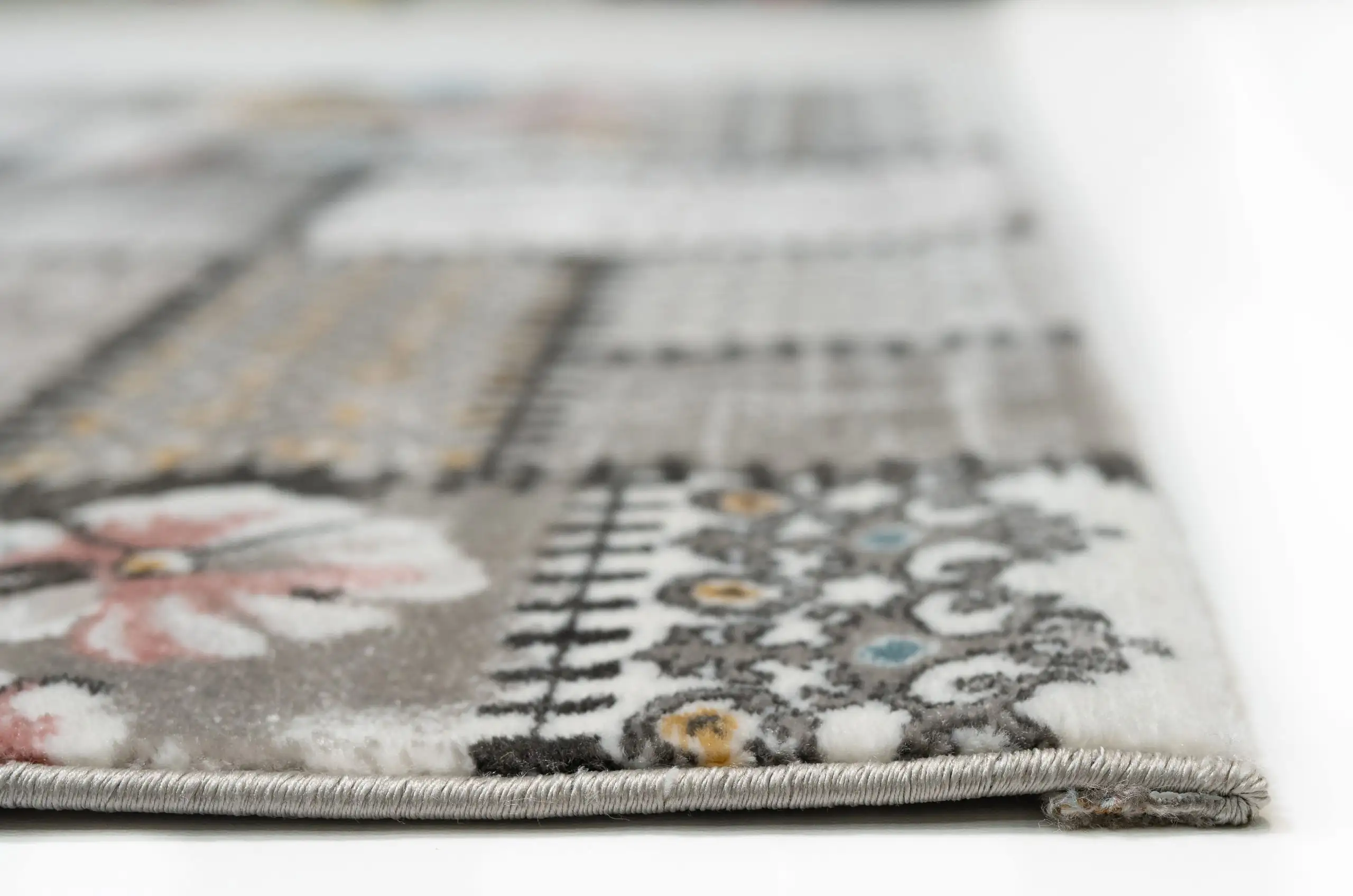 Carpets A close-up of a carpet's edge, with a focus on the intricate patterns and textures