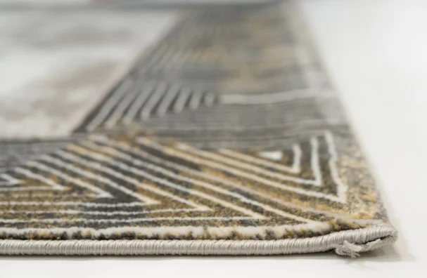 A close-up of a Qaleen Carpets rug, showcasing its intricate patterns and high-quality materials