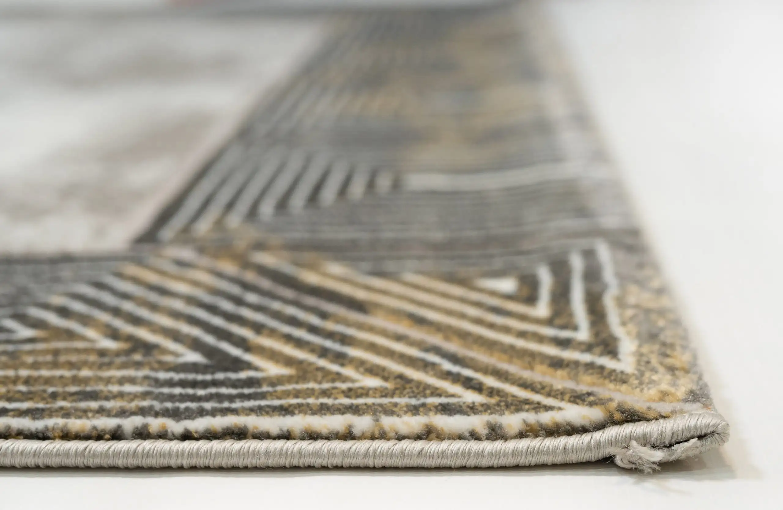 A close-up of a Qaleen Carpets rug, showcasing its intricate patterns and high-quality materials