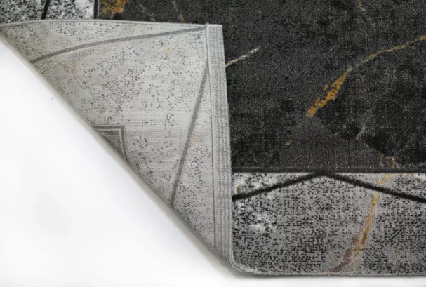 A close-up of a rug's corner, revealing its intricate design and Qaleen Carpets' quality