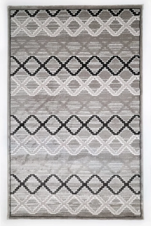 A high-quality, intricately designed rug with a mix of grey, white, and black patterns, made by Qaleen Carpets