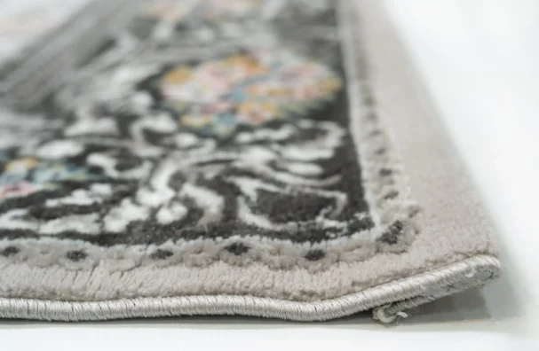 A close-up view of a Qaleen Carpets rug, showcasing its intricate design and soft, plush texture