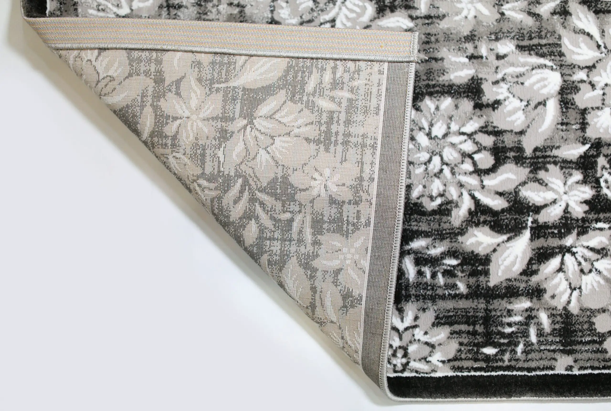 Carpets A high-quality image of a carpet with a floral pattern, showcasing its soft and durable design