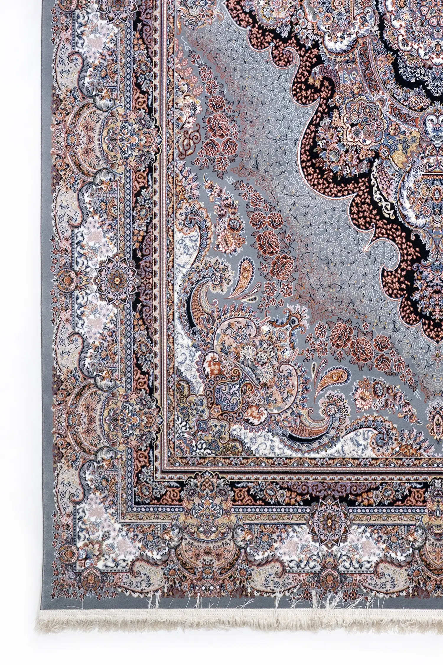 A close-up of a Qaleen Carpets rug with intricate patterns and a rich, vibrant color palette, showcasing the company's