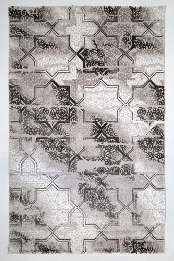 A stunning Qaleen Carpets rug with a unique blend of traditional and modern patterns, featuring a mix of intricate designs