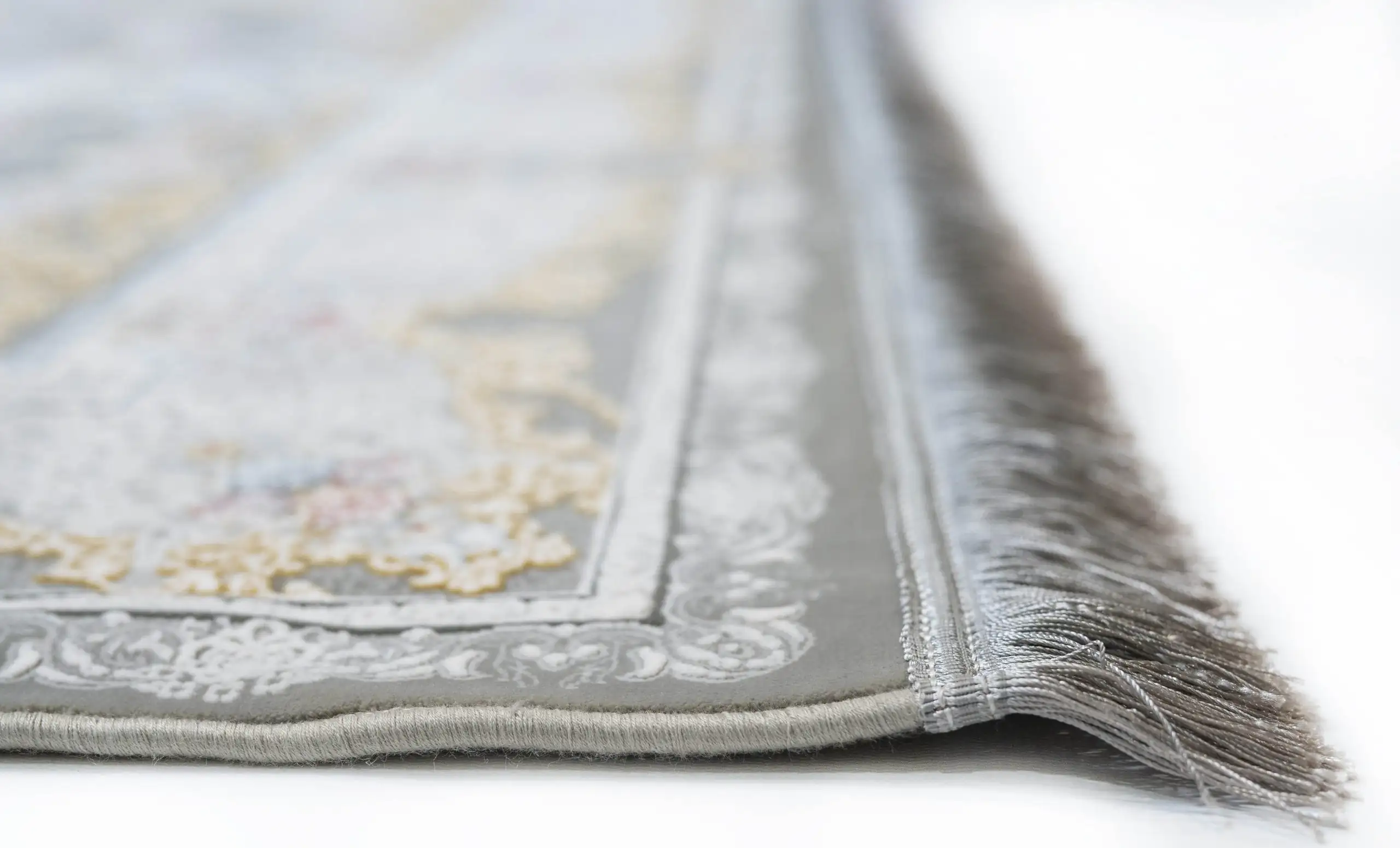 Carpets A close-up of a carpet's edge, with a focus on the intricate patterns and textures