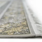 Carpets A close-up view of a carpet's edge, showcasing its intricate design and delicate fringes