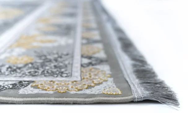 Carpets A close-up of a carpet's edge, with a focus on the intricate design and the soft, fluffy texture of the carpet's edge
