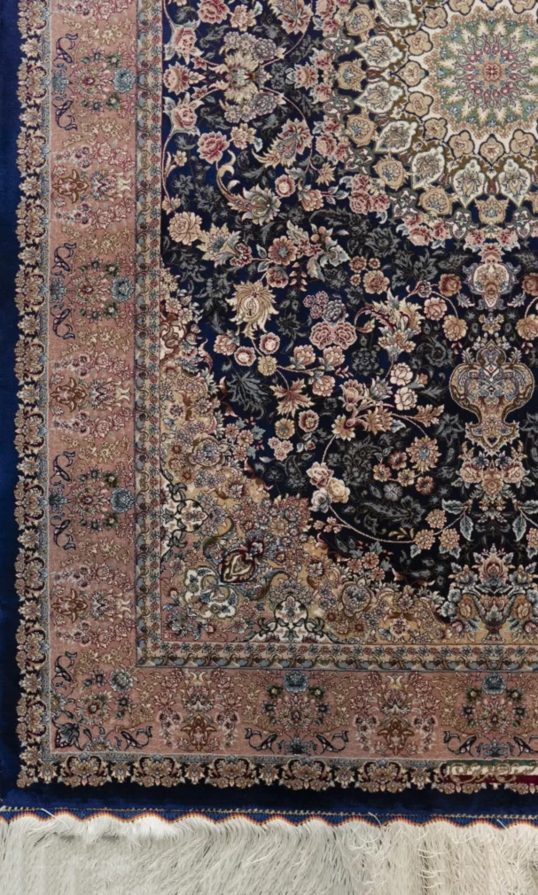 Carpets A beautiful, intricately designed carpet with a rich, dark blue background and intricate patterns of flowers and