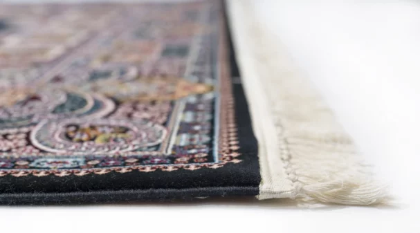 Carpets A close-up of a carpet's edge, with a focus on the intricate patterns and colors