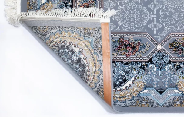 Carpets A beautifully crafted carpet with intricate patterns and a rich, vibrant color palette, showcasing the art of