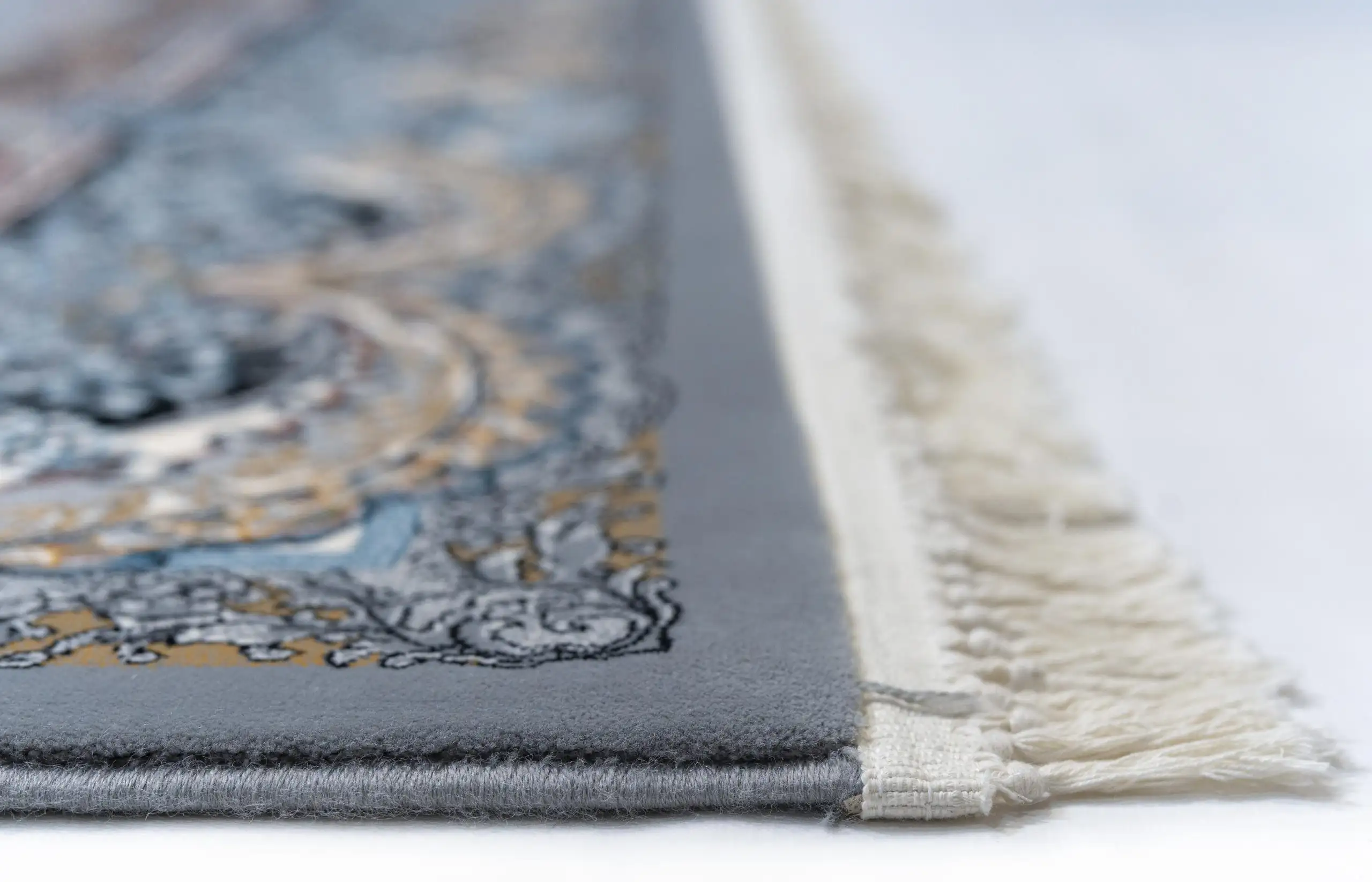 Carpets A close-up of a carpet's edge, with a focus on the intricate design and texture