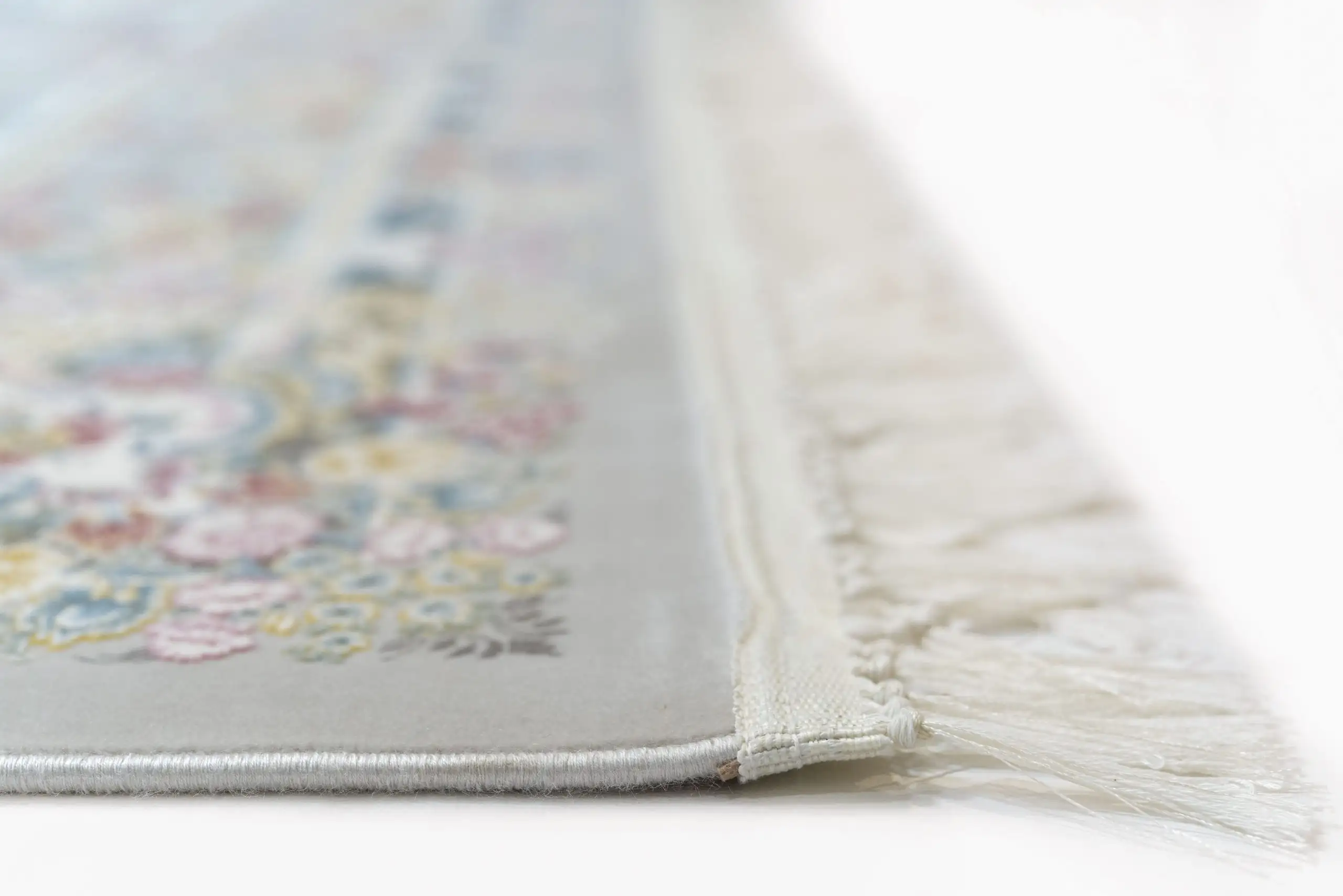Carpets A close-up of a carpet's edge, with a focus on the intricate design and the soft, fluffy texture of the carpet's edge
