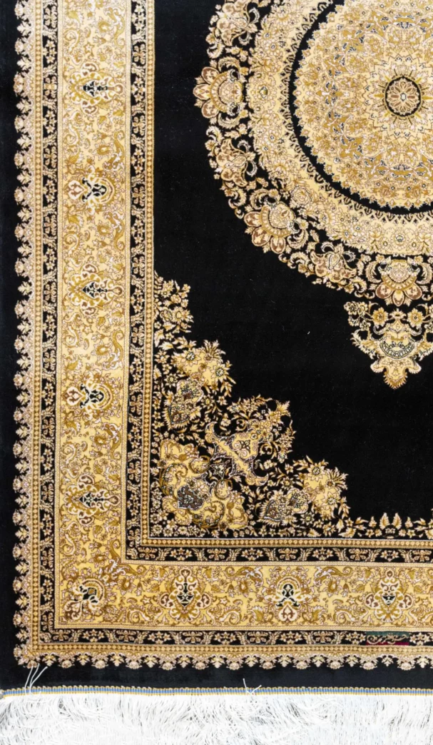 A beautiful, intricately designed carpet with a rich, dark background and a stunning, golden, intricate pattern, perfect for