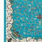 Carpets A vibrant, intricately designed carpet with a rich, blue background and a white border, featuring a mix of floral