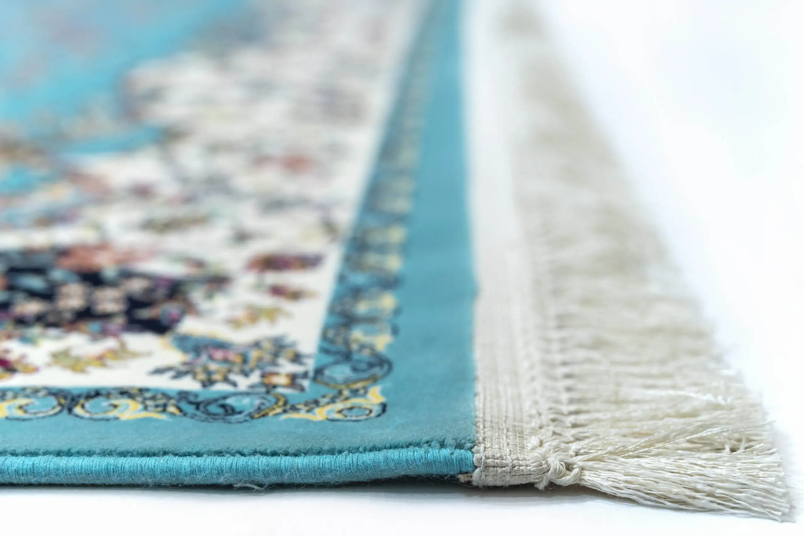 Carpets A close-up of a rug's edge, with a focus on the intricate patterns and colors
