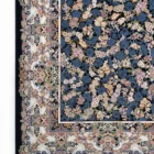 A Qaleen Carpets rug with a dark blue background and a floral pattern in various colors, including pink, yellow, and blue,