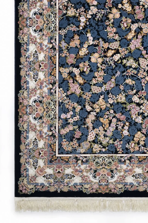 A Qaleen Carpets rug with a dark blue background and a floral pattern in various colors, including pink, yellow, and blue,