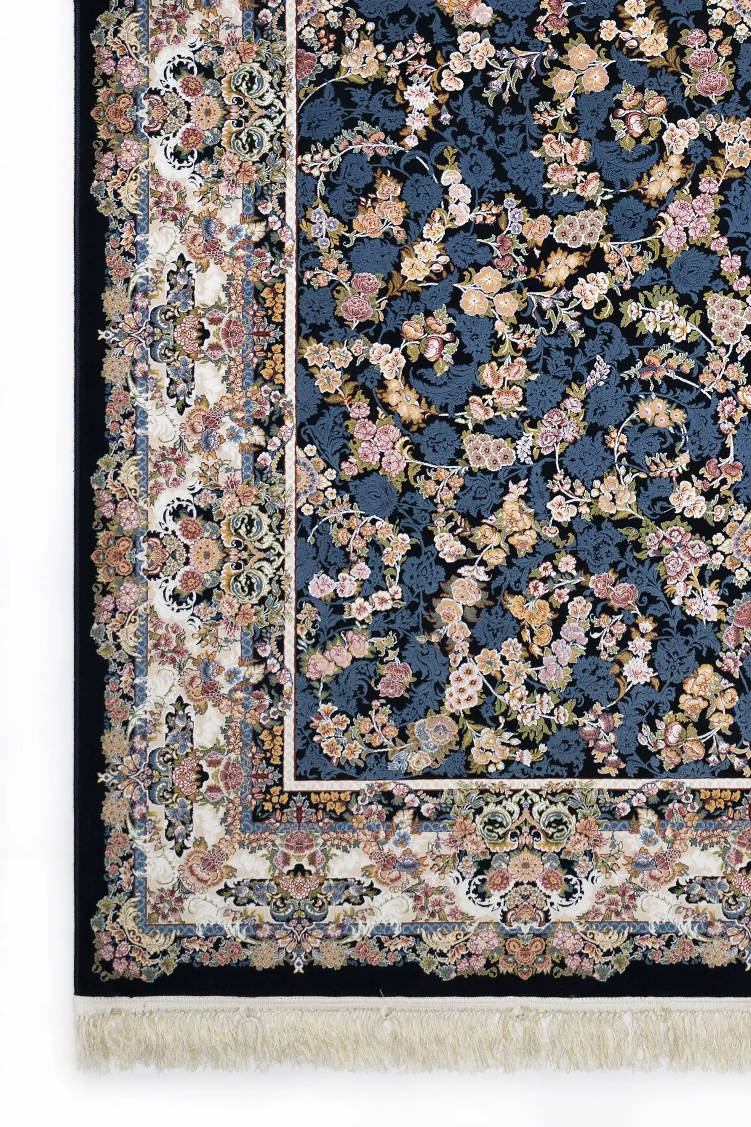 A Qaleen Carpets rug with a dark blue background and a floral pattern in various colors, including pink, yellow, and blue,