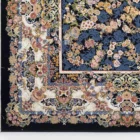 A close-up view of a Qaleen Carpets rug, showcasing its intricate design and rich colors