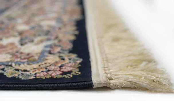 Carpets A close-up of a carpet's edge, with a focus on the intricate design and the soft, fluffy texture of the carpet's edge