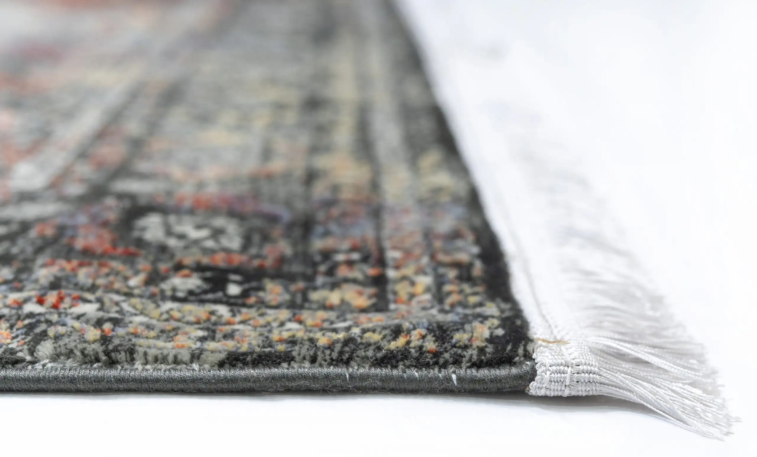 Carpets A close-up of a carpet's edge, with a focus on the intricate patterns and textures
