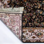 Carpets A carpet with a floral pattern and a fringe of white