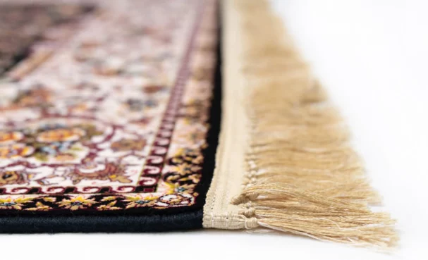 Carpets A close-up of a rug's edge with a fringe
