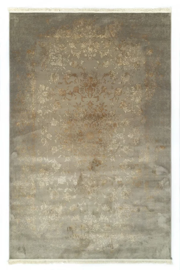 A Qaleen Carpets rug with a distressed, vintage-inspired design in a neutral color palette, featuring a mix of soft, muted