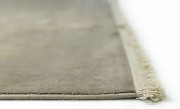 Carpets A close-up of a carpet's edge, with a focus on the stitching and the carpet's texture