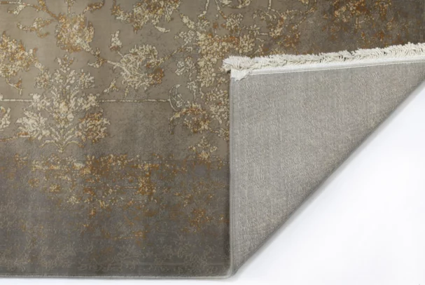 A high-quality image of a carpet with a subtle, intricate design, showcasing the beauty of carpets and rugs