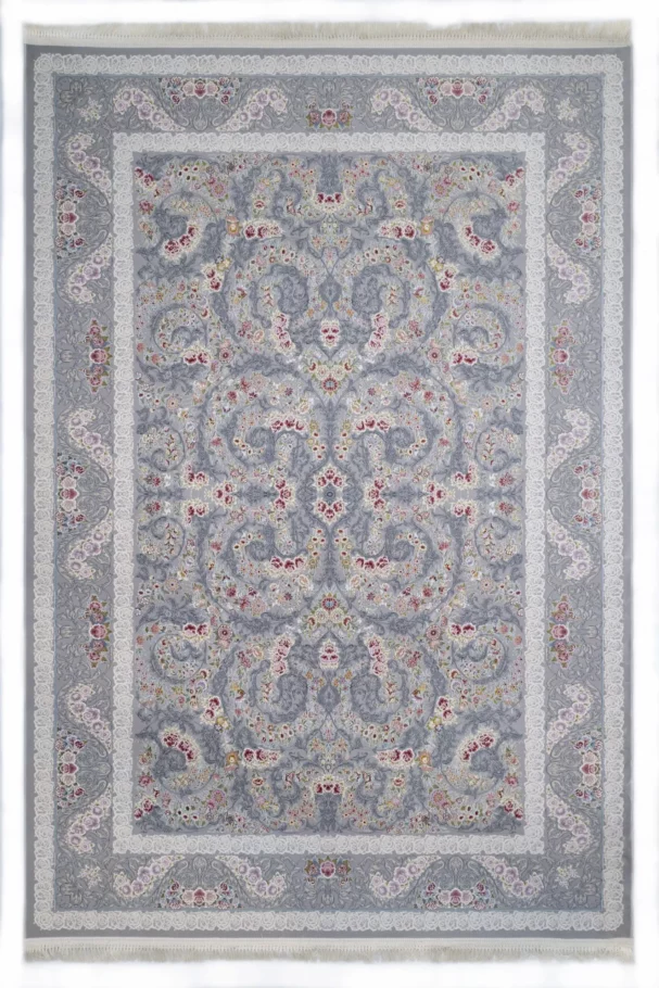 A Qaleen Carpets rug with a light grey and white patterned design, featuring a central floral pattern surrounded by a border